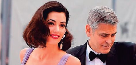 Papá y mamá Clooney fascinan en Venecia